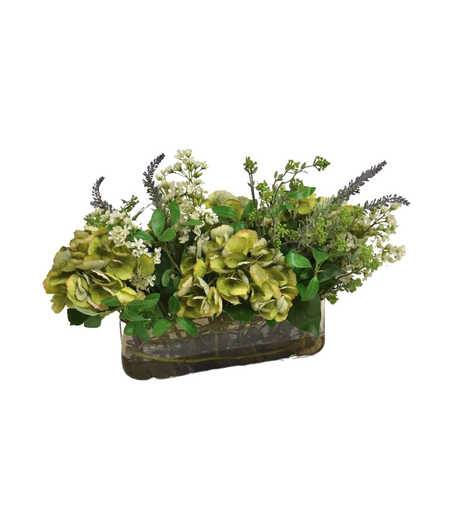 Arreglo Floral de Hydrangeas en Tonos Verdes y Follajes Artificiales en Base de Vidrio Rectangular con Agua Acrílica