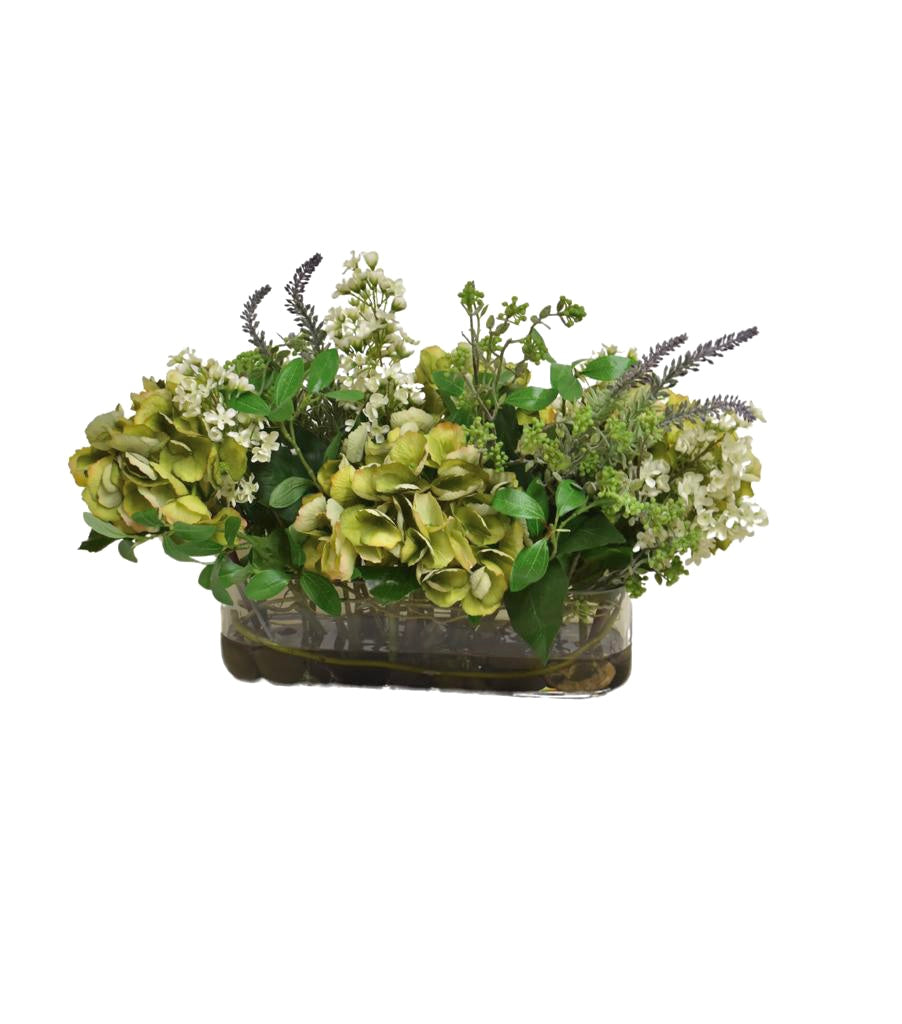 Arreglo Floral de Hydrangeas en Tonos Verdes y Follajes Artificiales en Base de Vidrio Rectangular con Agua Acrílica